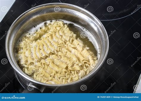 Noodles in the pot - Add the pieces of butter, cover, and cook on LOW for 3-4 hours, or on HIGH for 2-3 hours. When the internal temperature of the chicken is 165°F/74°C, take it out and put it on a cutting board. Add uncooked noodles and frozen vegetables to the crockpot. Stir so that the noodles are submerged.